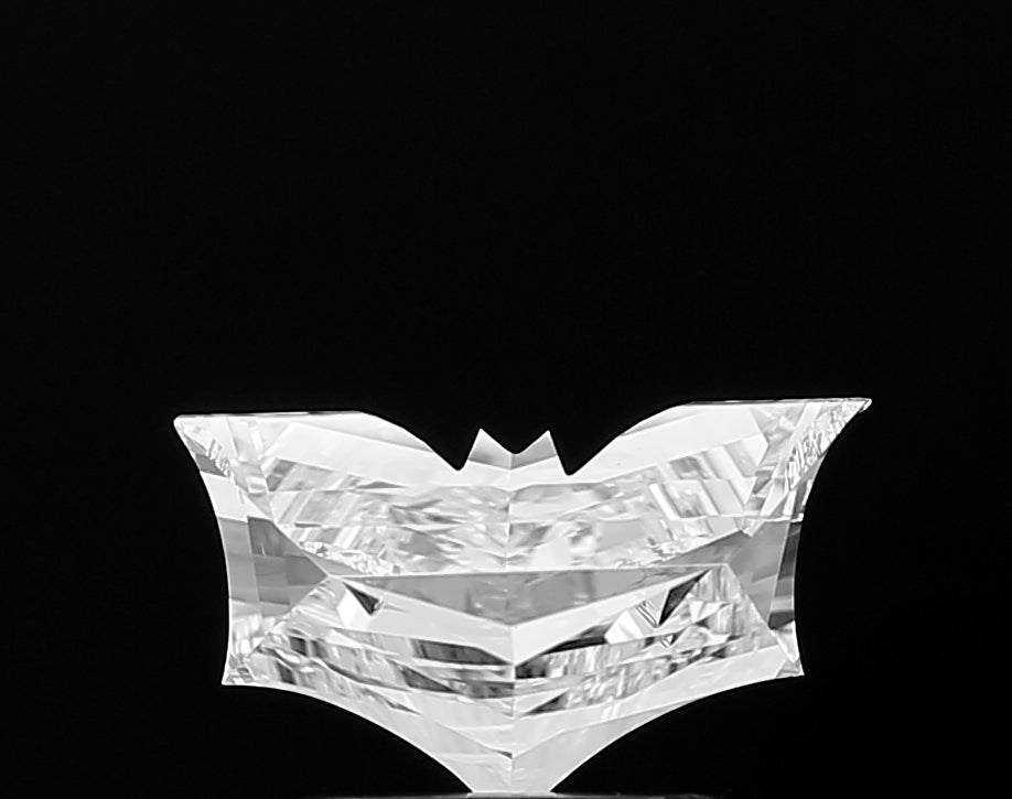 A mesmerizing close-up of a **Bat Shape** lab grown diamond, showcasing its incredible inner fire, exceptional light play, and masterful cutting for ultimate sparkle.