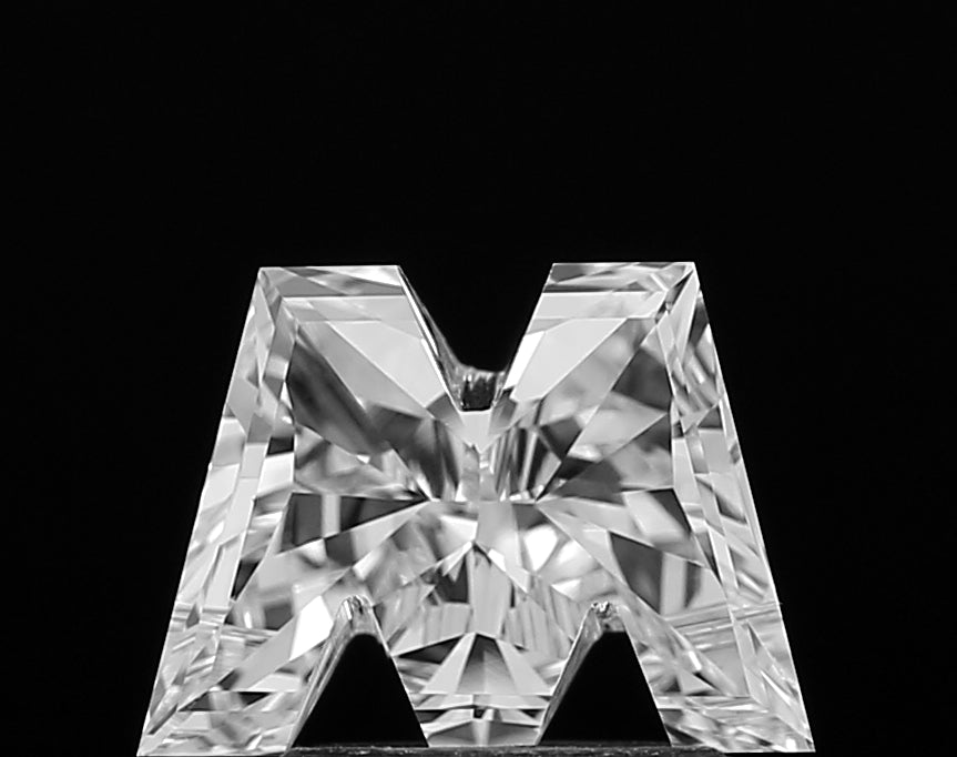 Authentic IGI certified lab grown Alphabet M shape cut diamond shown with its grading certificate, confirming its quality and ethical origin.