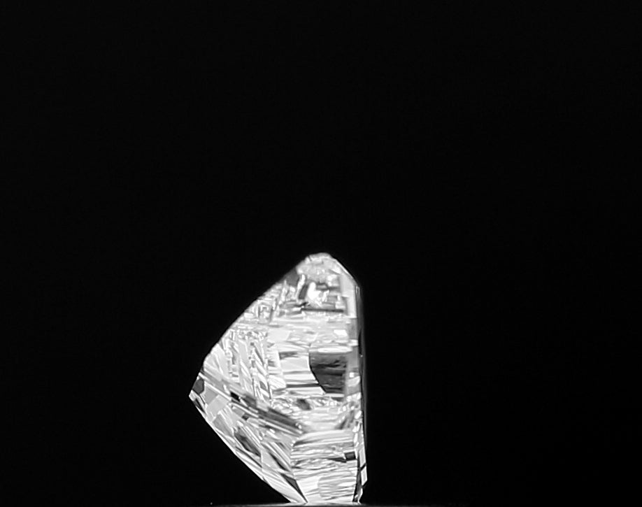 Authentic IGI certified lab grown **Bat Shape** diamond, presented with its official grading report, assuring its superior quality and ethical origin for peace of mind.
