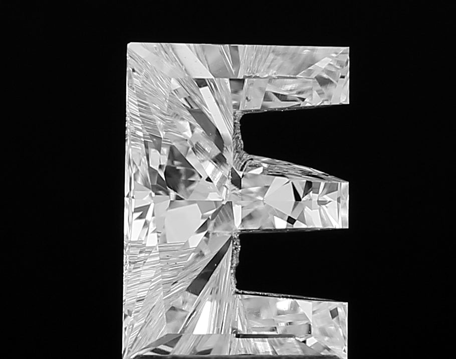 Authentic IGI certified lab grown Alphabet E shape cut diamond shown with its grading certificate, confirming its quality and ethical origin.