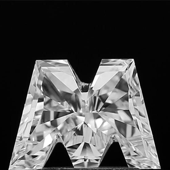 360-degree video showcase of a loose lab grown Alphabet M shape cut diamond, revealing its intricate design, full dimensions, and mesmerizing sparkle from every angle.